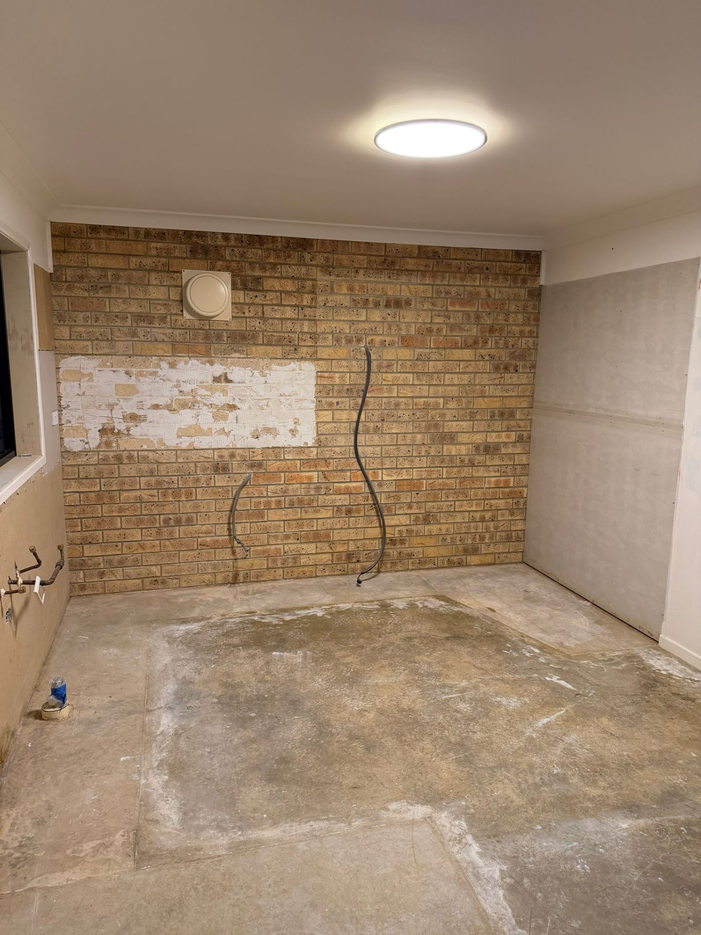Residential strip-out in Gympie, South East Queensland, with kitchen taken back to brick and slab